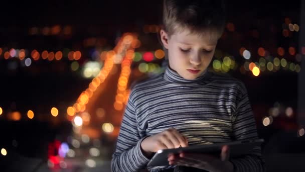 Boy plays the game with tablet — Stock Video