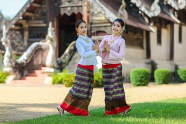 Girls with Thai northern style in Sawasdee action clipart