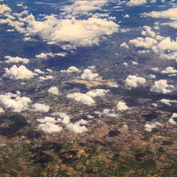 Aerial view of clouds and village — Stock Photo, Image