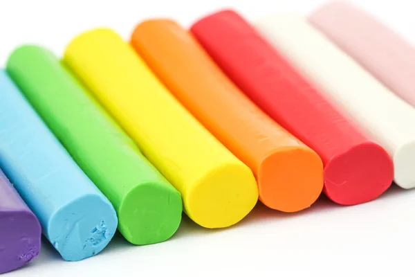 Colorful rod plasticine arranging on white background — Stock Photo, Image