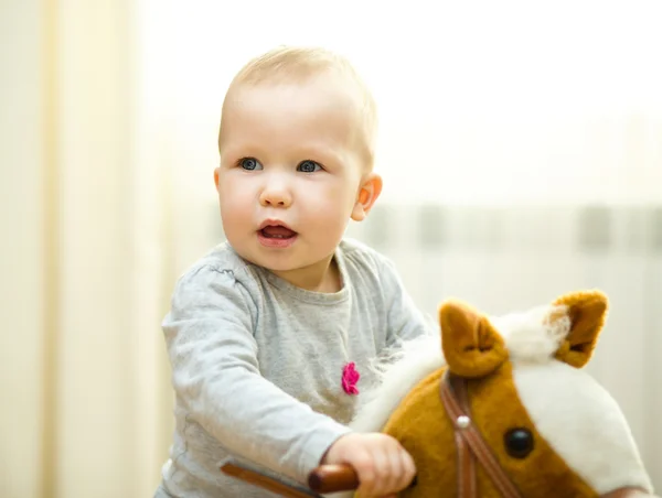 Little girl playing with toys — Stock Photo, Image