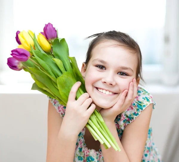 Happy girl with flowers — Stock Photo, Image