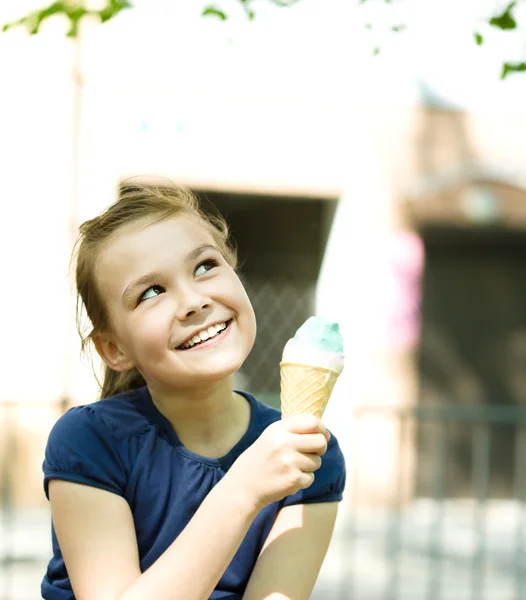 Girl is eating ice-cream — Stock Photo, Image