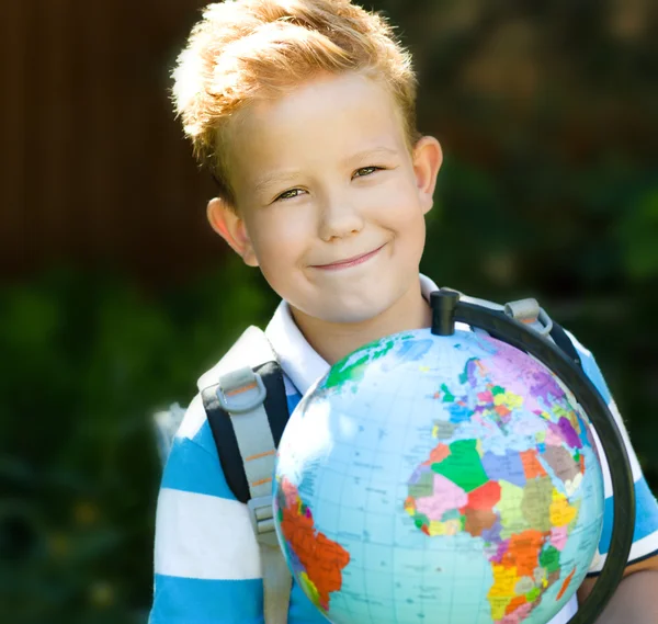 Cute boy is holding globe — Stock Photo, Image