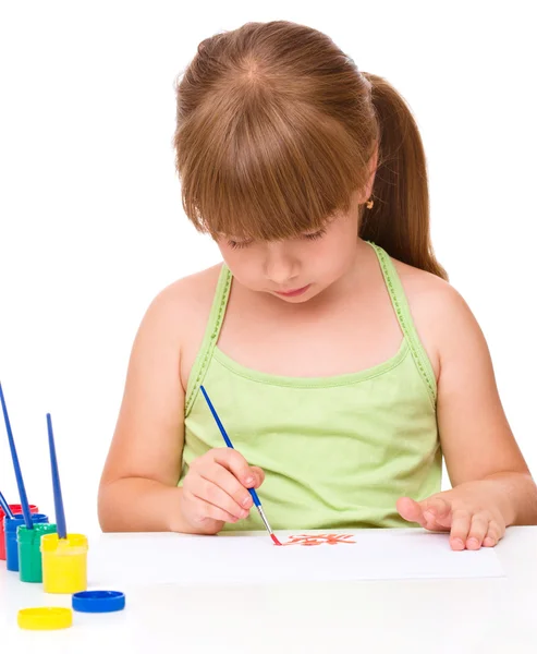 Cute thoughtful child play with paints — Stock Photo, Image