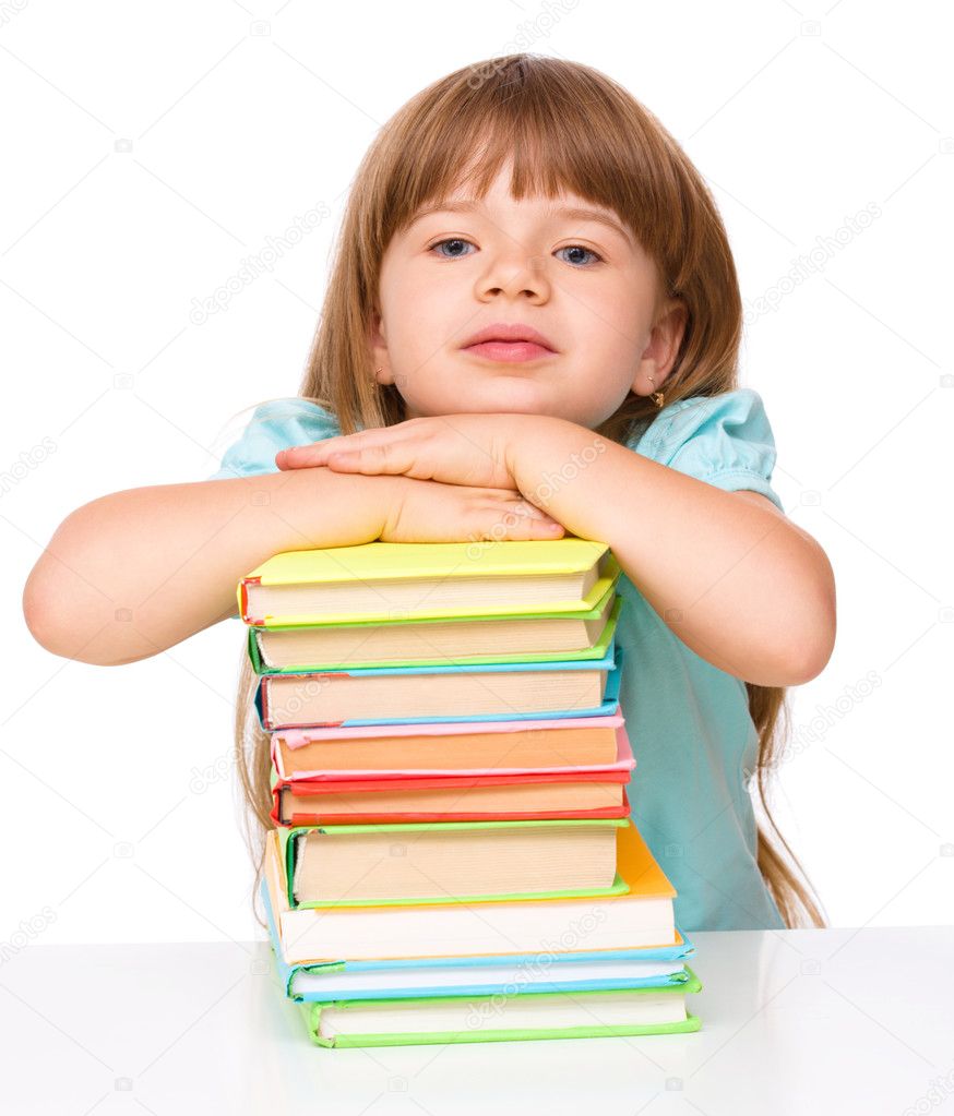 Cute girl is reading book