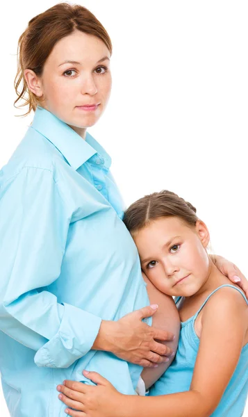 Child holding belly of pregnant woman — Stock Photo, Image