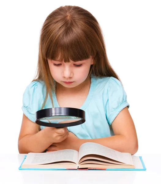 Cute girl is reading book — Stock Photo, Image