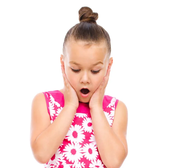 Cute girl is holding her face in astonishment — Stock Photo, Image