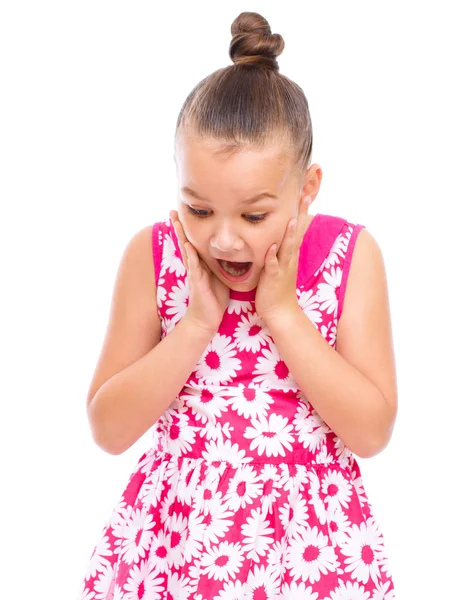 Cute girl is holding her face in astonishment — Stock Photo, Image