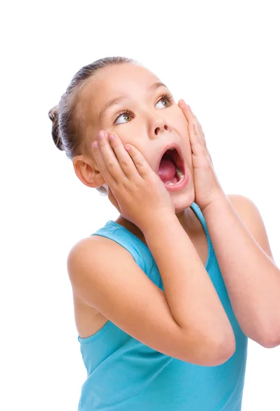 Cute girl is holding her face in astonishment — Stock Photo, Image