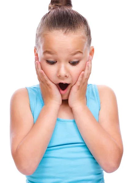 Cute girl is holding her face in astonishment — Stock Photo, Image