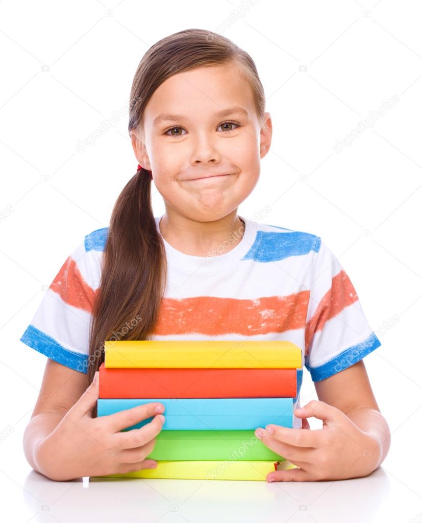 Cute girl is reading book