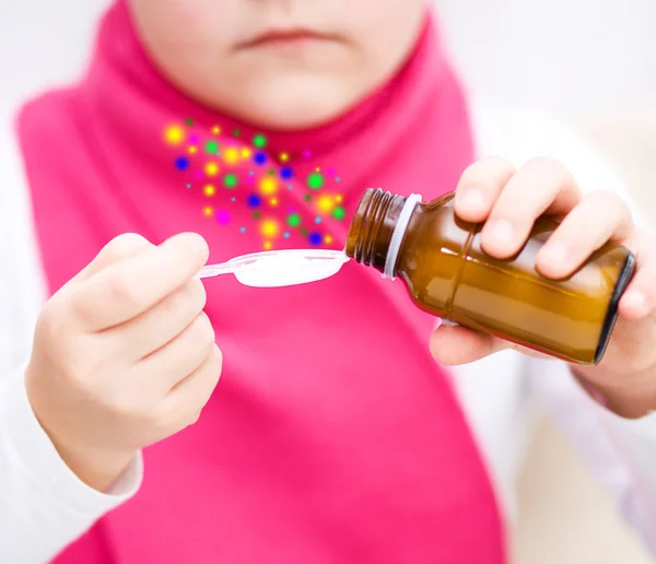 Hands holding medicine health care syrup — Stock Photo, Image