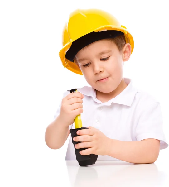 Boy as a construction worker with tape measure — Stock Photo, Image