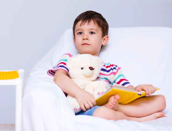 Little boy is reading a book — Stock Photo, Image