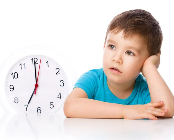 Boy is holding big clock — Stock Photo, Image