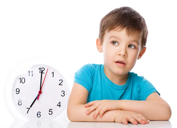 Boy is holding big clock — Stock Photo, Image