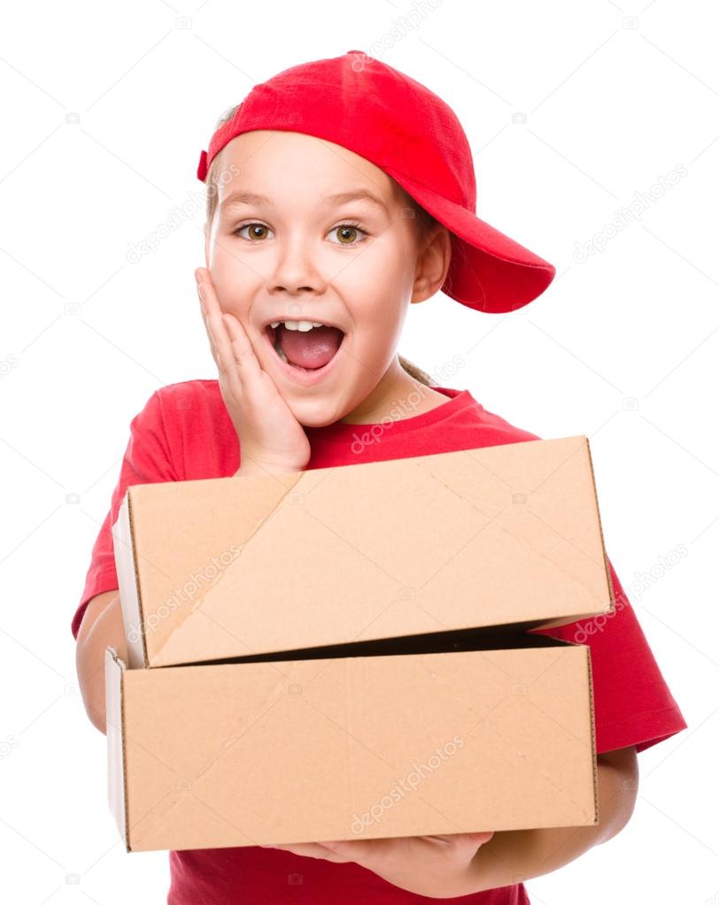 Happy girl holding cardboard boxes