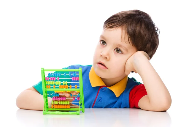 Boy is playing with building blocks — Stock Photo, Image