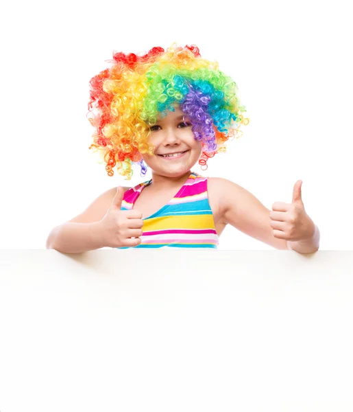 Meisje in clown houdt lege banner — Stockfoto