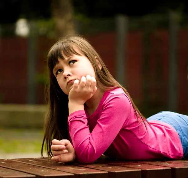 Cute girl is holding her face in astonishment — Stock Photo, Image