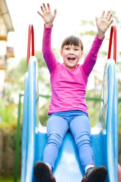 Girl is playing on playground — Stock Photo, Image