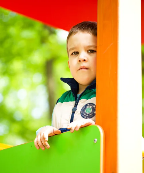 Little boy is playing on playground — Stock Photo, Image