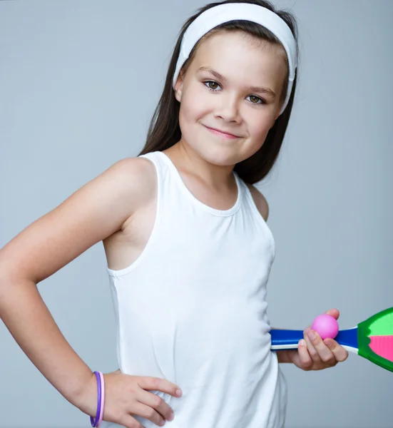 Beautiful girl athletes with a tennis racket and the tennis ball — Stock Photo, Image