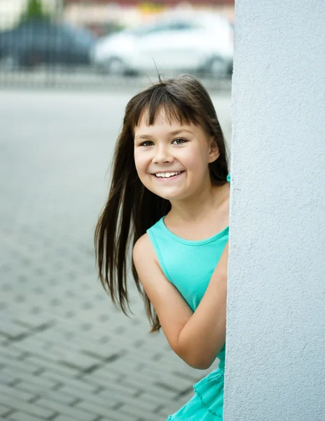 Young girl is playing outdoors — Stock Photo, Image