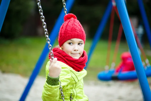 Girl is playing on playground — Stock Photo, Image