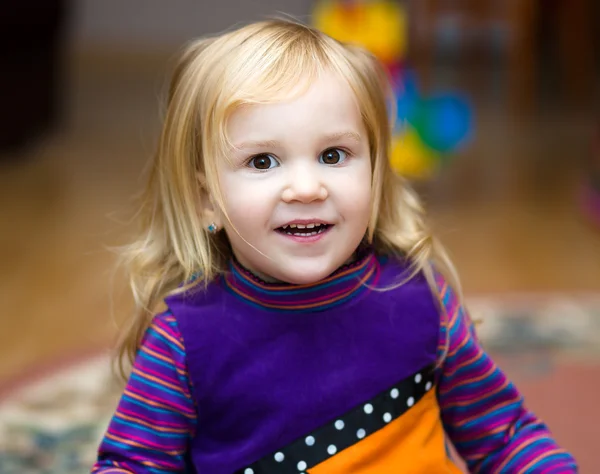 Little girl playing with toys — Stock Photo, Image