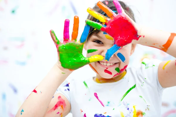 Cute girl playing with paints — Stock Photo, Image