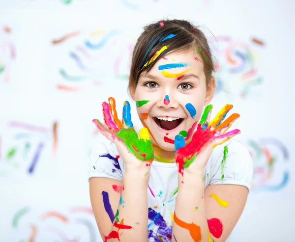 Cute girl playing with paints — Stock Photo, Image