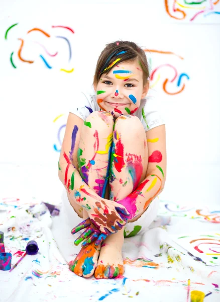 Cute girl playing with paints — Stock Photo, Image