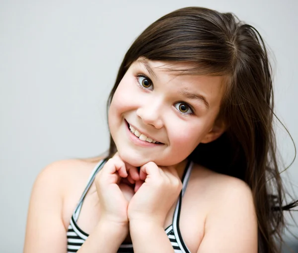 Cute girl is holding her face in astonishment — Stock Photo, Image