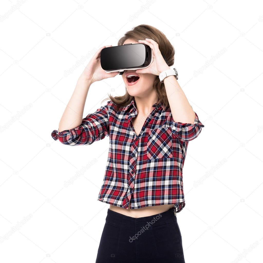 Happy girl getting experience using VR headset glasses of virtual reality, much gesticulating hands, isolated