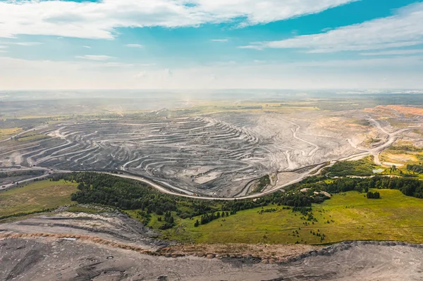 Panoramic aerial view of coal mine. Open pit mine industry, big yellow mining truck for coal quarry. Open coal mining anthracite mining. Pit on coal mining by open way. Rock loading in trucks — Stock Photo, Image
