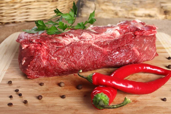 Raw meat beef, thick edge on a wooden board — Stock Photo, Image