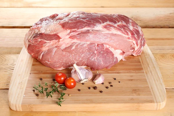 Raw meat pork neck boneless on a wooden board — Stock Photo, Image