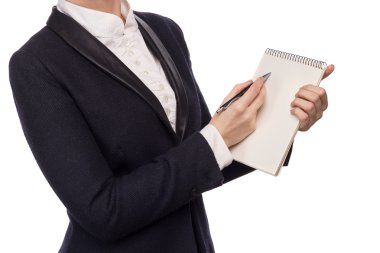 Elinde bir kalem ve defter tutan bir iş takım elbise