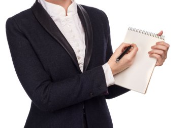 Elinde bir kalem ve defter tutan bir iş takım elbise