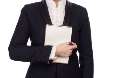 Elinde bir kalem ve defter tutan bir iş takım elbise