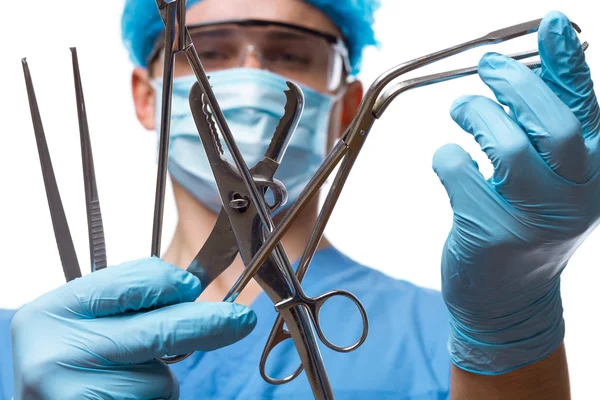 Mann Arzt Chirurg mit chirurgischen Instrumenten Stockfoto