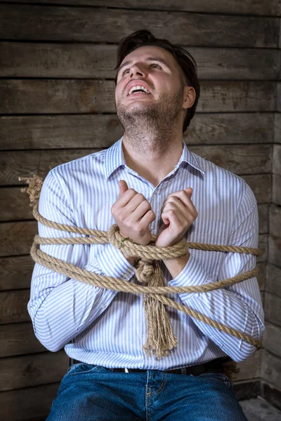 Amarrado com um homem de negócios de corda — Fotografia de Stock