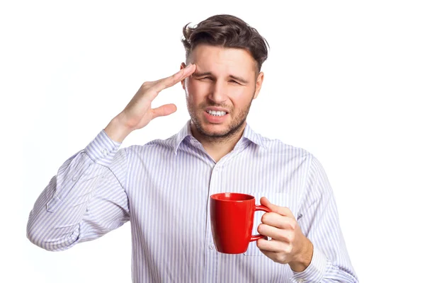 Jóképű üzletember egy piros pohár tartó fejfájás — Stock Fotó