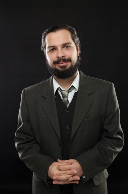 kostüm üçlü bir siyah arka plan üzerine bir sakallı şeytani yakışıklı adam