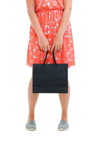 Fashion woman portrait isolated. White background. Happy girl hold shopping bag. Red dress. female beautiful model. — Stock Photo, Image