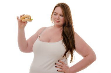 şişman kadın beyaz arka plan üzerinde izole hamburger yemek