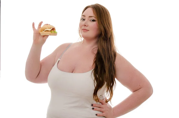 Mujer gorda comiendo hamburguesa aislada sobre fondo blanco — Foto de Stock